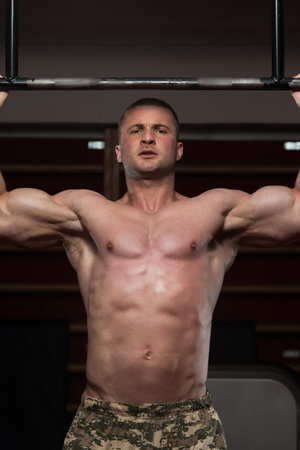 Adult Male Athlete Doing Pull Ups - Chin-Ups In The Gym - Best Exercise For Back