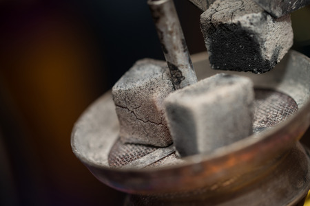 Preparation The Hookah With Charcoal For Smoking The Traditional Hubble-Bubbleの写真素材