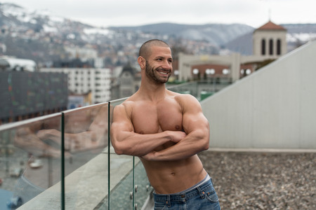 Portrait Of A Physically Fit Young Man Posing Outdoorsの写真素材
