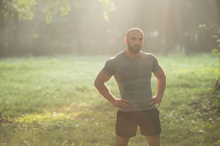 Portrait Of A Physically Fit Young Man Posing Outdoorsの写真素材