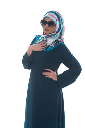 Fashion Portrait Of Young Beautiful Muslim Woman With Black Scarf And Sunglasses Isolated On White Backgroundの写真素材