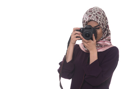 Arab Woman Photographer Holding A Dslr Camera Isolated On A White Backgroundの写真素材