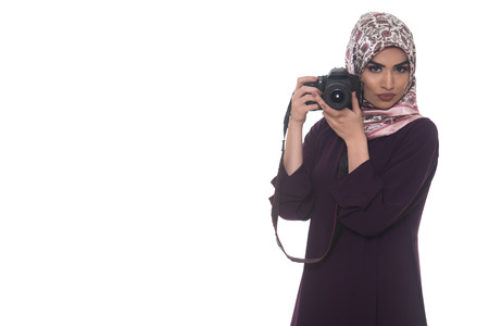 Arab Woman Photographer Holding A Dslr Camera Isolated On A White Backgroundの写真素材
