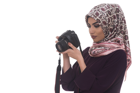 Arab Woman Photographer Holding A Dslr Camera Isolated On A White Backgroundの写真素材