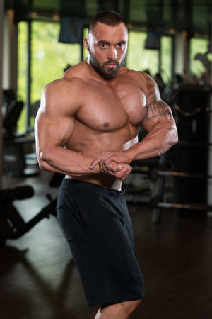 Bodybuilder Posing - Handsome Power Athletic Guy Male - Fitness Muscular Bodyの写真素材