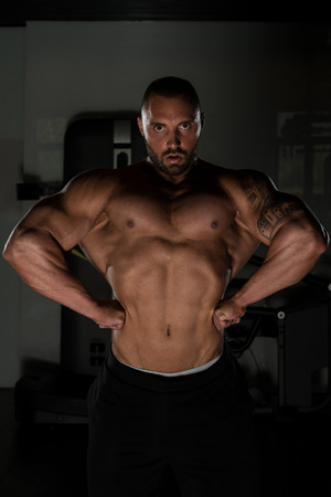 Bodybuilder Posing - Handsome Power Athletic Guy Male - Fitness Muscular Bodyの写真素材