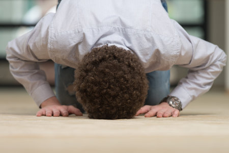 White Muslim Man Is Praying In The Mosque - Afro Lock Hair Curly