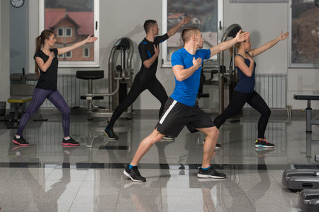 Group Of Friends Exercising Together During A Gym Class