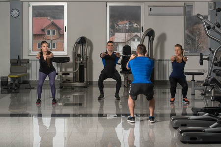 Group Of People At The Gym In A Stretching Classの写真素材