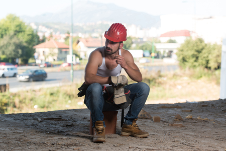 Construction Worker Relaxing The Fresh Air During Workの写真素材