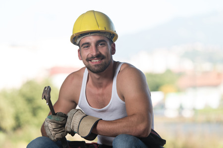 Construction Worker Relaxing The Fresh Air During Workの写真素材