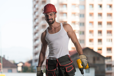 Portrait Of Handsome Male Architect Engineer With Red Helmetの写真素材