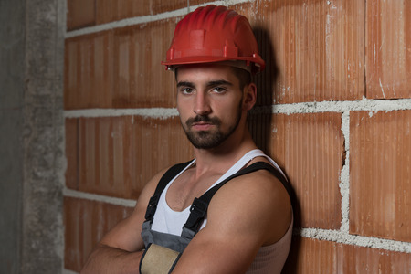 Portrait Of Handsome Male Architect Engineer With Red Helmetの写真素材