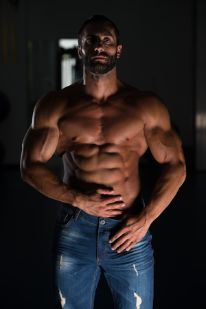 Portrait Of A Sexy Muscular Man In Pants Posing After Exercise In Gymの写真素材