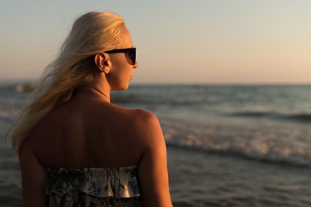 Relaxed Woman In Dress Enjoying Tropical Beach And Caribbean Summer Vacation - Fit Tanned Brunette Enjoying A Walk In The Seaの写真素材