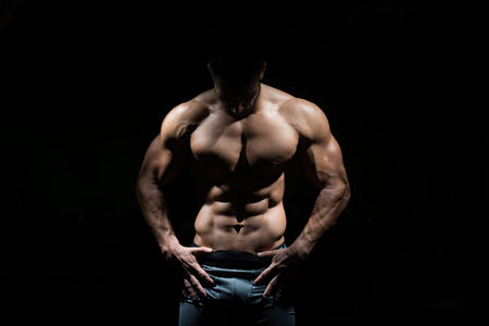 Portrait Of A Young Physically Fit Man Showing His Well Trained Body - Muscular Athletic Bodybuilder...