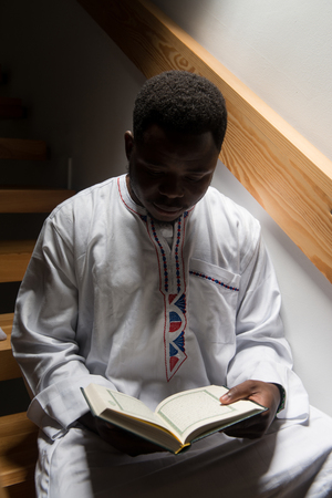 African Muslim Man Making Traditional Prayer To God While Wearing A Traditional Cap Dishdashaの写真素材