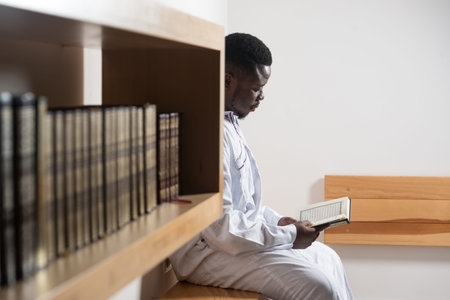 African Muslim Man Making Traditional Prayer To God While Wearing A Traditional Cap Dishdasha