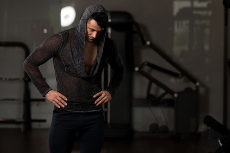 Portrait of a Young Physically Fit Man in Black T-shirt Long Sleevs Showing His Well Trained Body - Muscular Athletic Bodybuilder Fitness Model Posing After Exercisesの写真素材