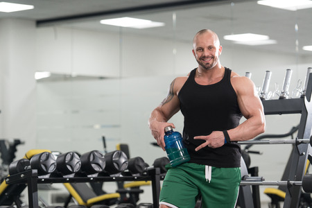 Muscular Handsome Bodybuilder With Pills And Dope For Copy Spaceの写真素材