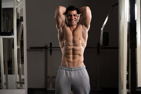 Portrait Of A Young Physically Fit Man Showing His Well Trained Body - Muscular Athletic Bodybuilder...