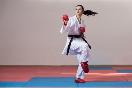 Young Woman Dressed In Traditional Kimono Practicing Her Karate Moves - Black Beltの写真素材