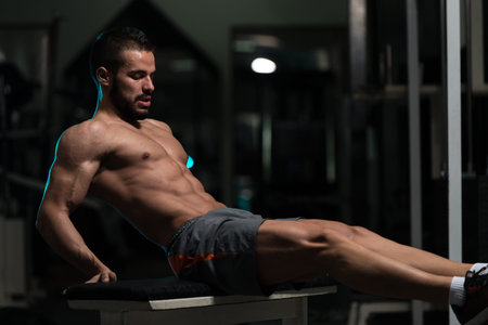 Exercising Abs On Bench Plank Hip Raise Abdominal Crunch In Fitness Club
