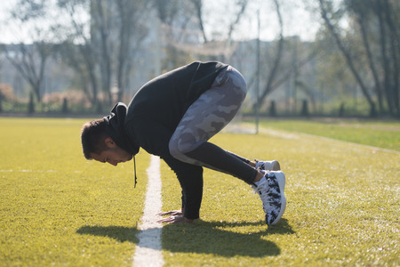Young Man Doing a Hand Stand in City Park Area - Training and Exercising for Endurance - Fitness Healthy Lifestyle Concept Outdoorの写真素材