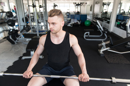 Handsome Good Looking And Attractive Young Man With Muscular Body Relaxing In Gymの写真素材