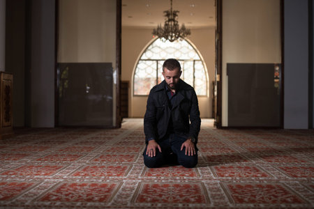 Adult Muslim Man Is Praying In The Mosque