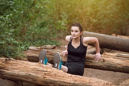 Young Woman Exercise In Wooded Forest Area - Fitness Healthy Lifestyle Conceptの写真素材
