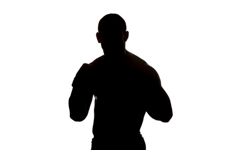 Silhouette Muscular Boxer MMA Fighter Practice His Skills - Isolated On White Backgroundの写真素材