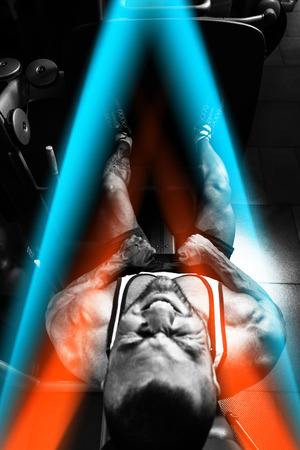Man Doing Leg With Machine In Gym - Leg Exercisesの写真素材