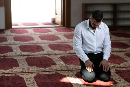 Businessman Muslim Making Traditional Prayer to God Allah in the Mosqueの写真素材