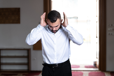 Businessman Muslim Making Traditional Prayer to God Allah in the Mosqueの写真素材