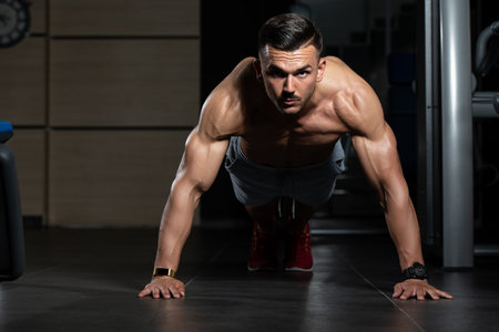 Young Model Doing Push Ups As Part Of Bodybuilding Training