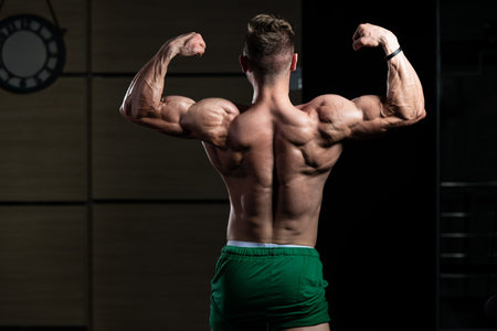 Portrait Of A Young Physically Fit Man Showing His Well Trained Body - Muscular Athletic Bodybuilder...