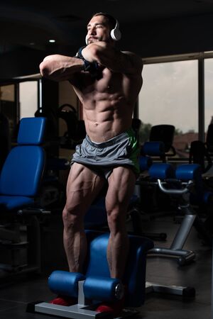 Leg Exercises -  Man Doing Legs Without Weights Squatsの写真素材