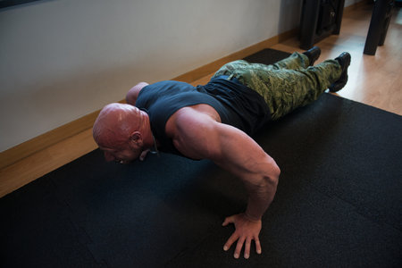 Athlete Doing Push-Up As Part Of Bodybuilding Training