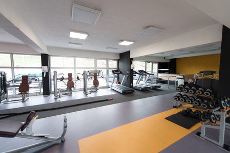 Modern Gym Room Fitness Center With Equipment And Machines