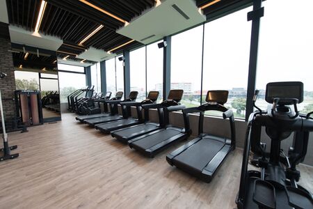 Modern Gym Room Fitness Center With Equipment And Machinesの写真素材