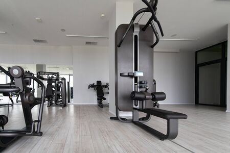 Modern Gym Room Fitness Center With Equipment And Machinesの写真素材