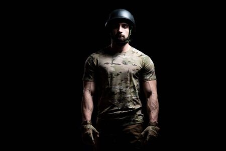 Portrait of a American Marine Corps Special Operations Modern Warfare Soldier With Helmet on Black Backgroundの写真素材