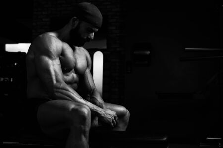 Handsome Good Looking And Attractive Young Man With Muscular Body Relaxing In Gymの写真素材