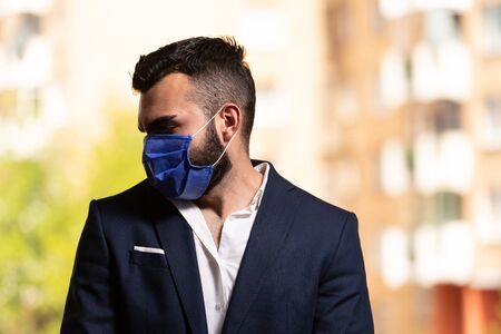 Young Muslim Man Praying in Mosque With Surgical Mask and Glovesの写真素材