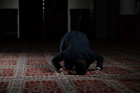 Businessman Muslim Making Traditional Prayer to God Allah in the Mosqueの写真素材