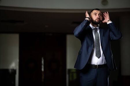 Businessman Muslim Making Traditional Prayer to God Allah in the Mosqueの写真素材