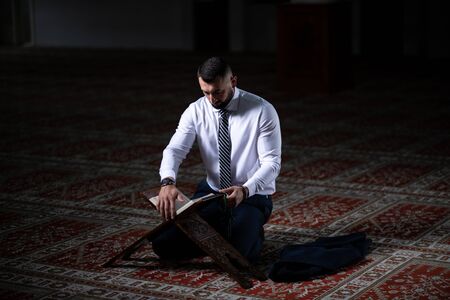 Businessman Muslim Making Traditional Prayer to God Allah in the Mosqueの写真素材