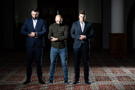 Portrait of a Three Adult Muslim Man is Praying in the Mosque
