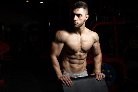 Young Muscular Men Resting After Exercises - Portrait Of A Physically Fit Young Man Without A Shirt